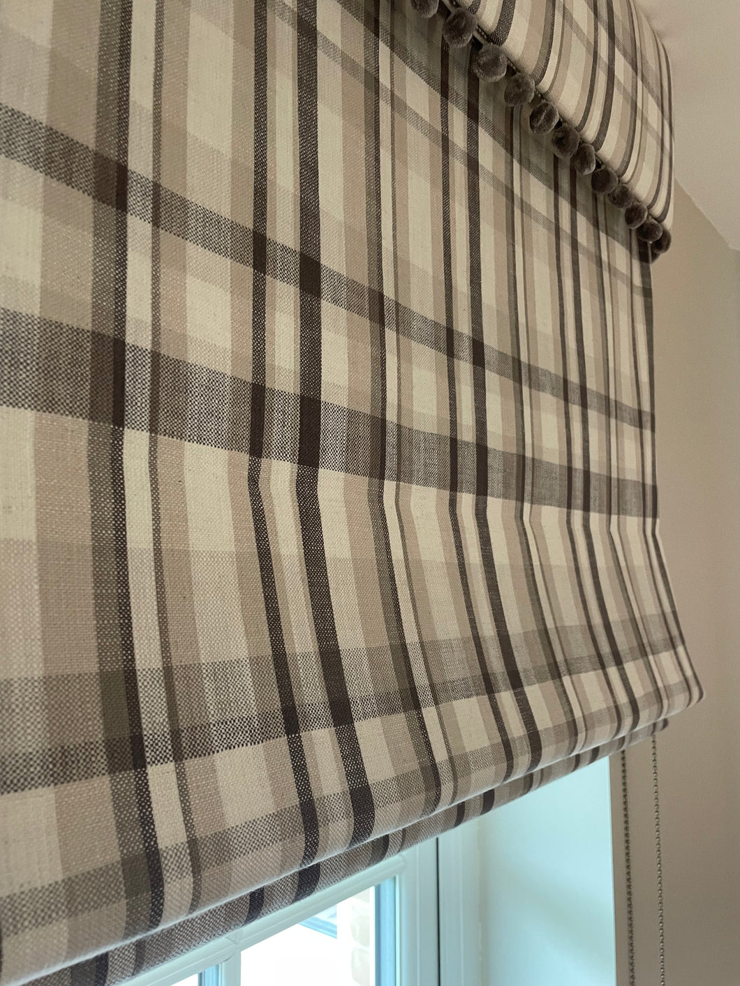 Checked roman blind with pelmet